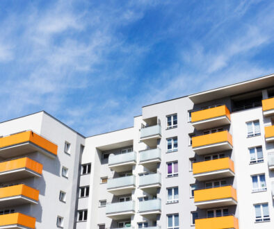 Building with red facade against blue sky background